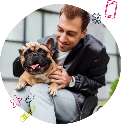 A man in a wheelchair with a dog on his lap