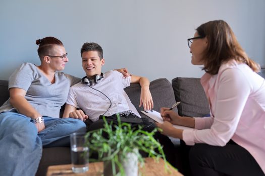 Mother with her teenage son at meeting with NDIS employment-related assessment and counselling service