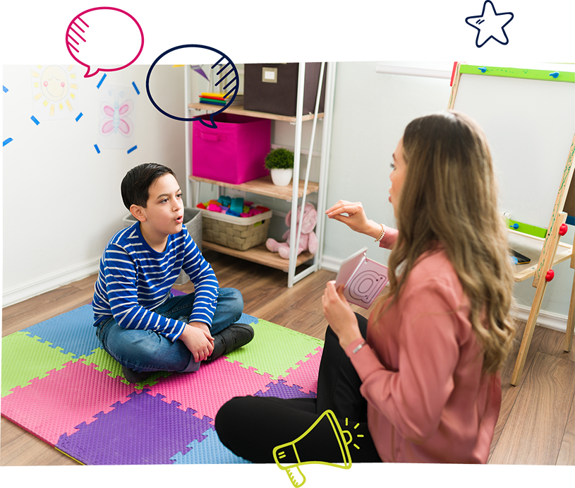 Female speech pathologist working with boy on pronunciation