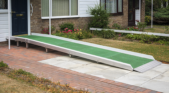 Ramp at the entrance to a building to enable a disabled wheelchair user to access it