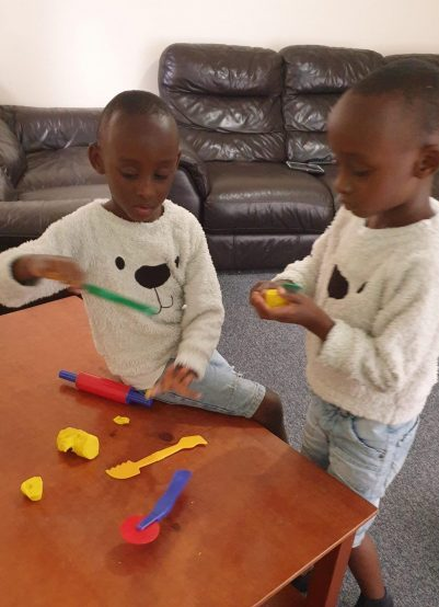 Ali and Abraham playing during OT appointment