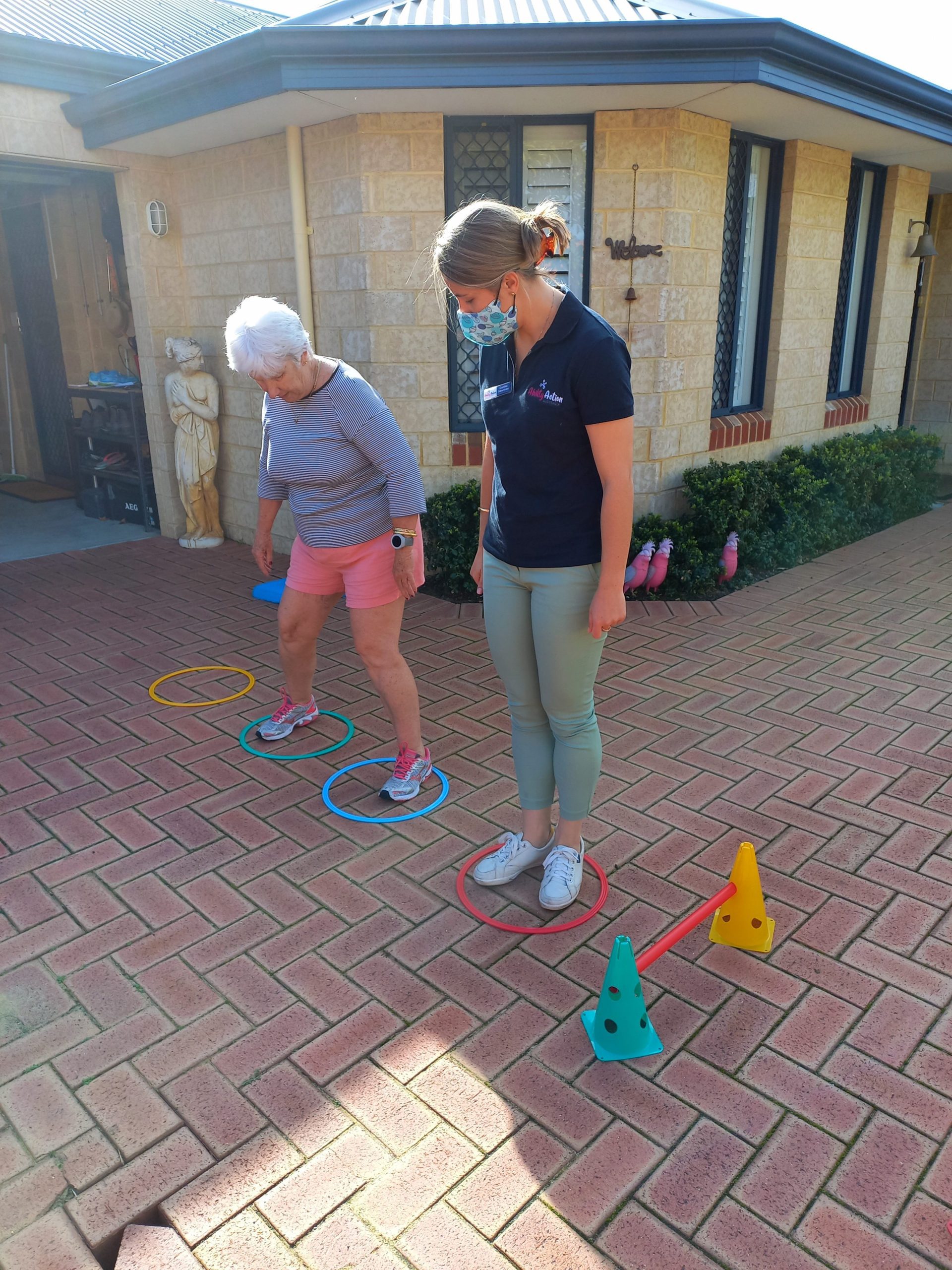 Appointment with accredited exercise physiologists taking place in driveway