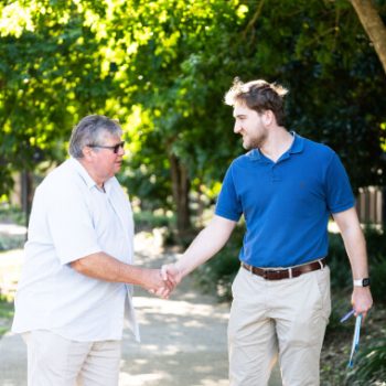 A man and woman shaking hands.